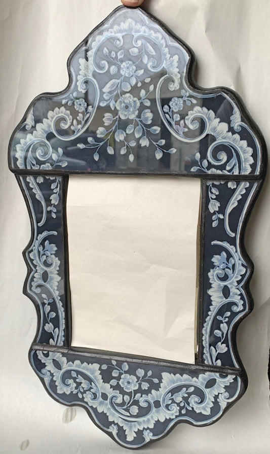 reverse painted glass mirror with painted flowers, black with white details
